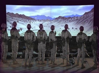 Trainees standing in formation before the simulator
